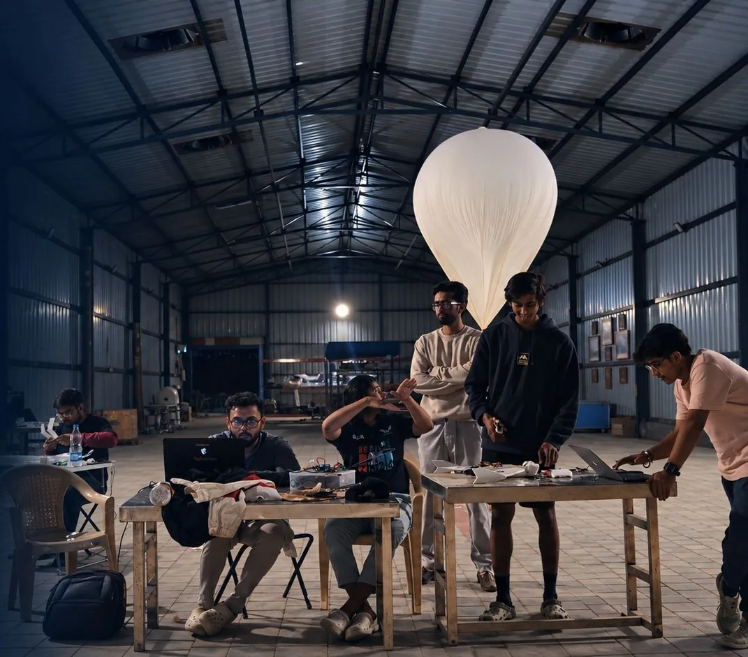 Kalam Labs engineers preparing a balloon and aircraft inside the hangar
